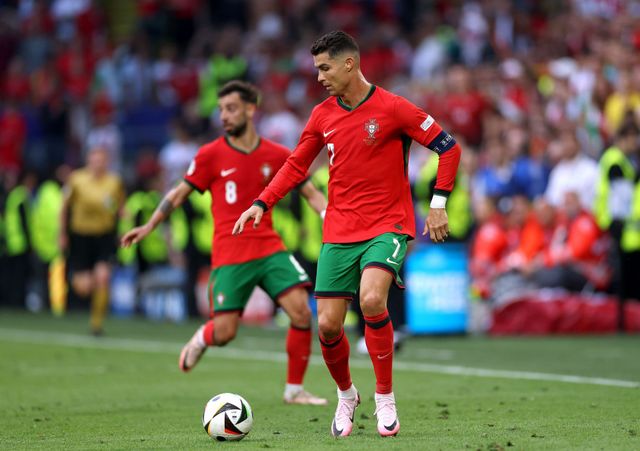 Cristiano Ronaldo shares heart-warming moment with young pitch invader ...