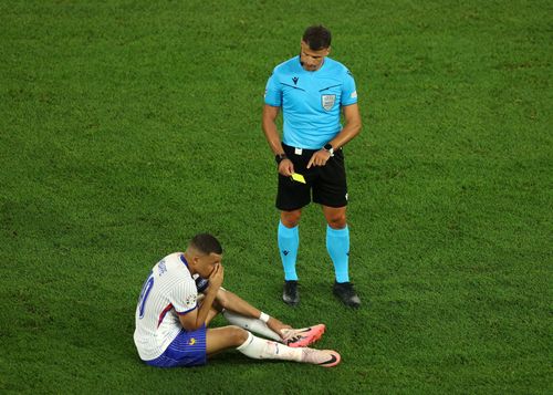 Kylian Mbappe was booked for re-entering play.