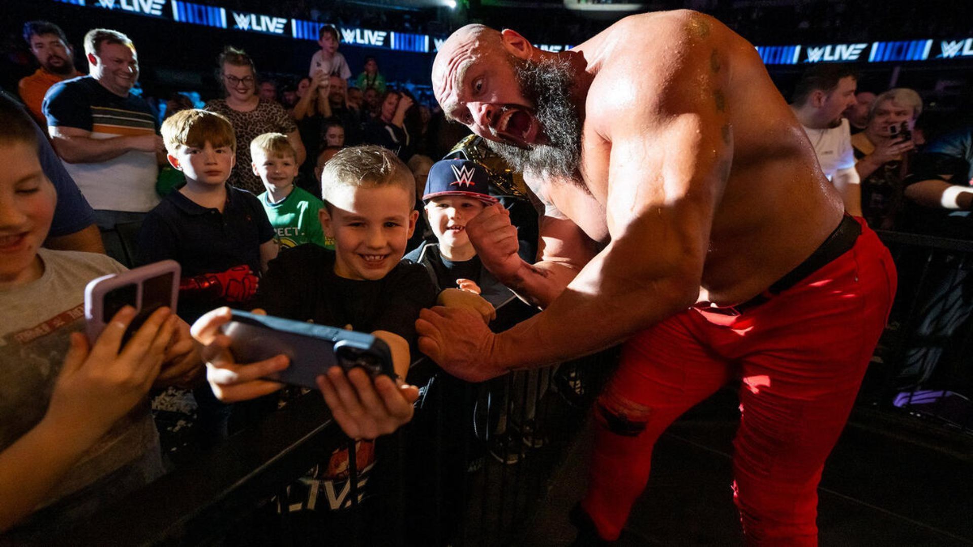 Braun Strowman celebrating with young fans [Photo credit: WWE]