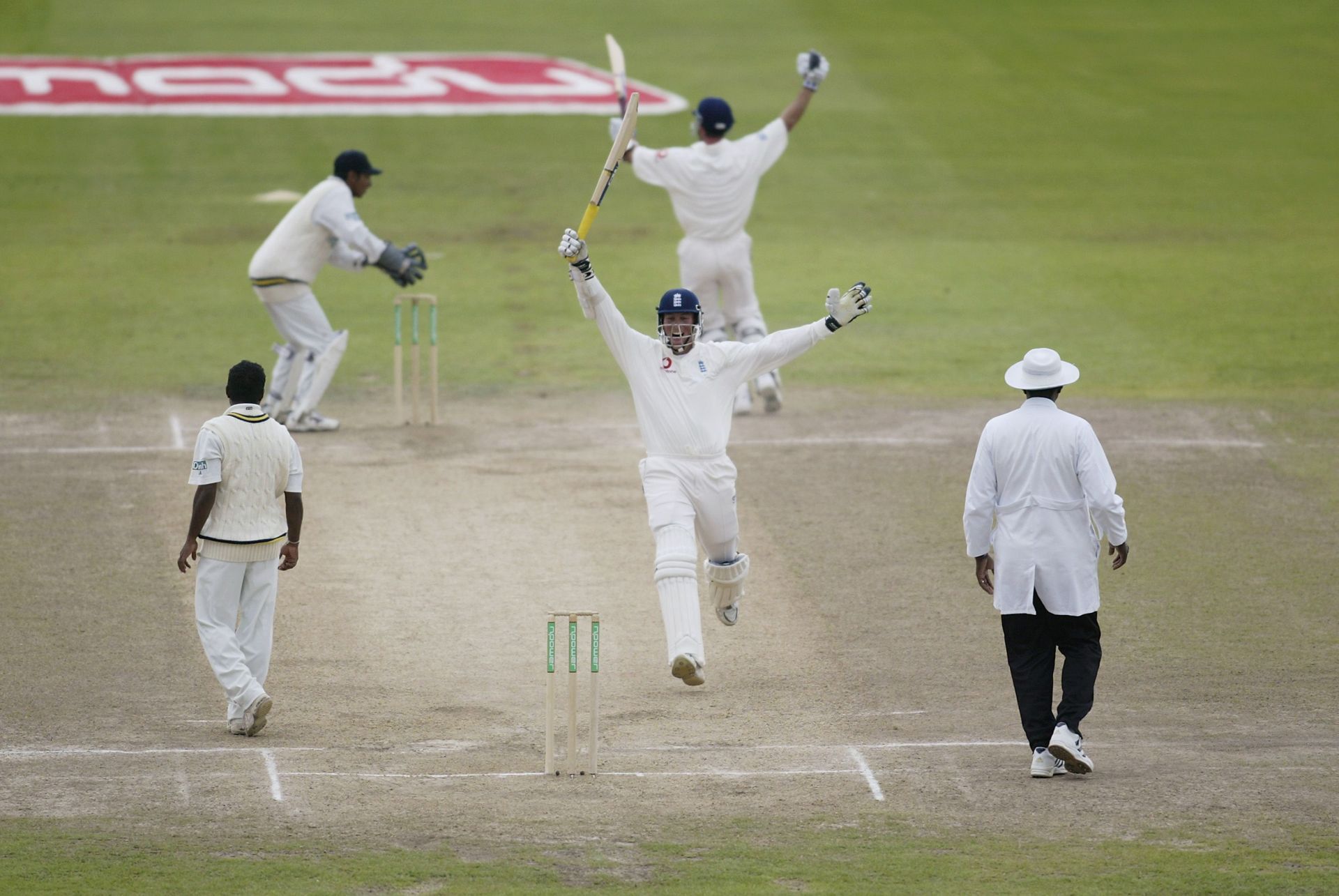 Marcus Trescothick and Michael Vaughan of England celebrate victory