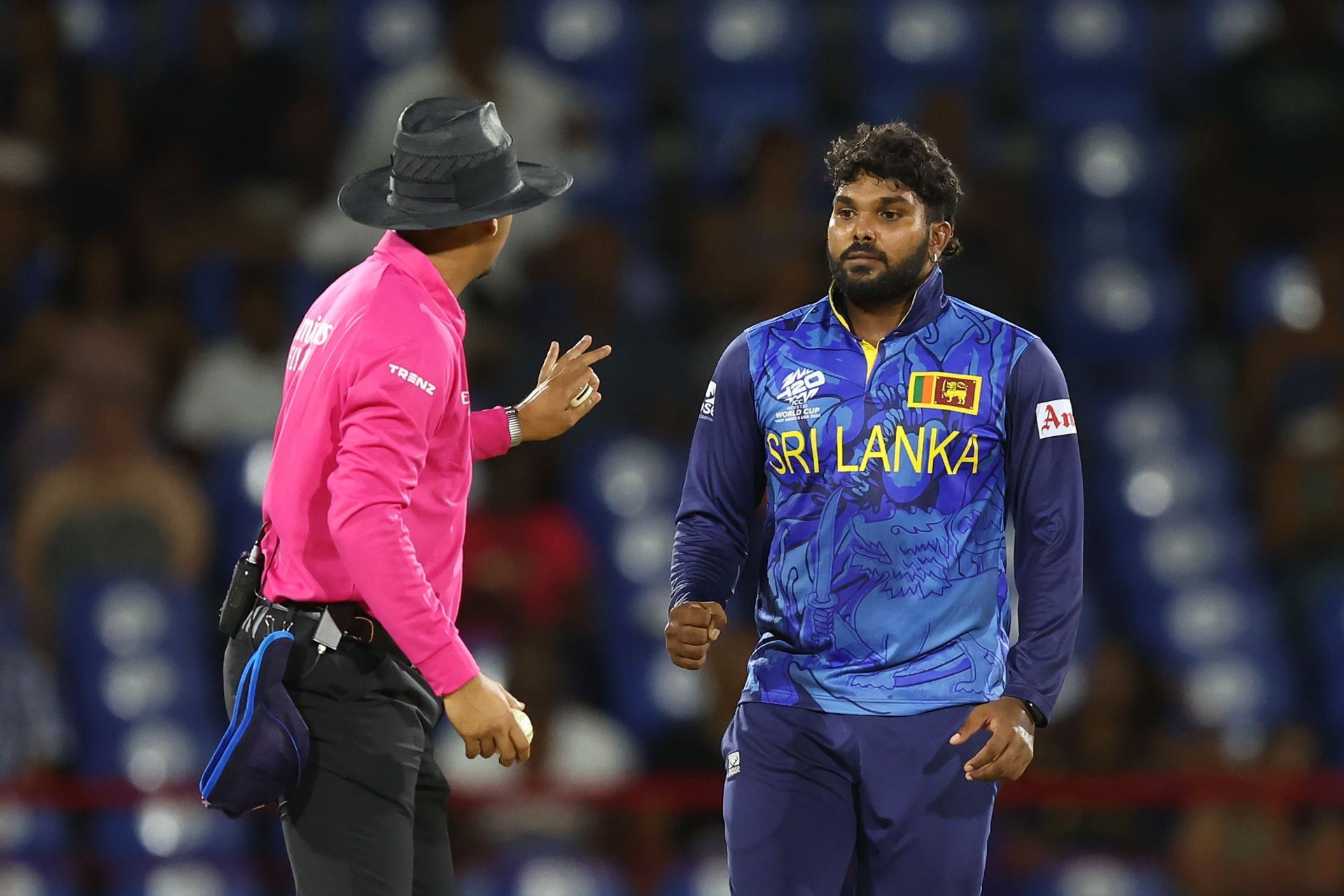 Wanindu Hasaranga of Sri Lanka interacts with Umpire Allahuddien Paleker during the ICC Men's T20 Cricket World Cup West Indies & USA 2024 match between Sri Lanka and the Netherlands at Daren Sammy National Cricket Stadium on June 16, 2024 in Gros Islet, Saint Lucia. (Photo by Robert Cianflone/Getty Images)