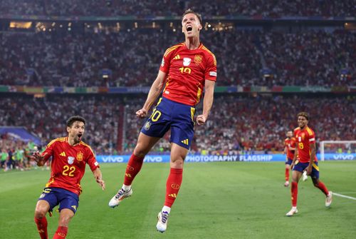 Spain striker Dani Olmo (centre)