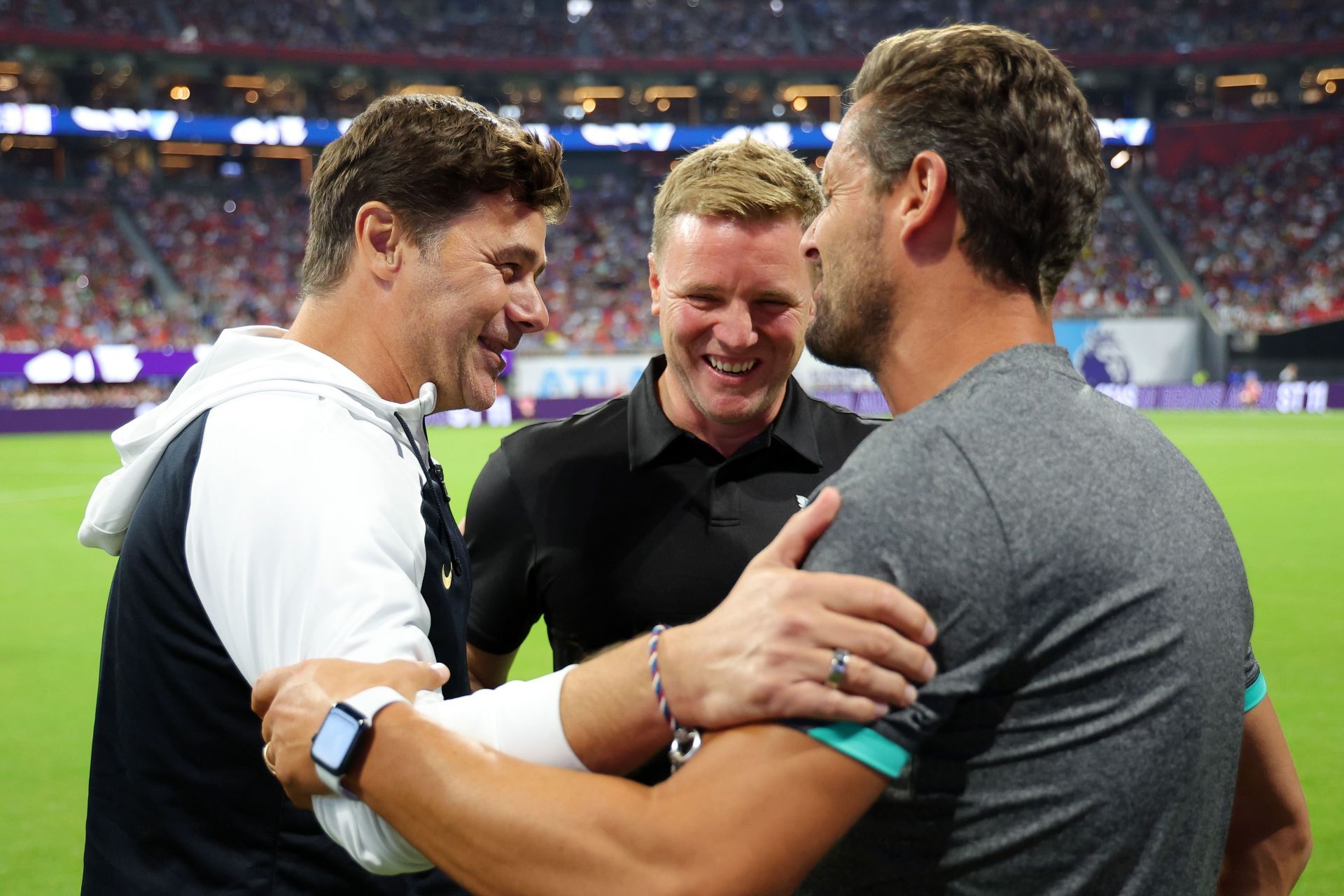 Mauricio Pochettino (left) received praise from Eddie Howe (middle).