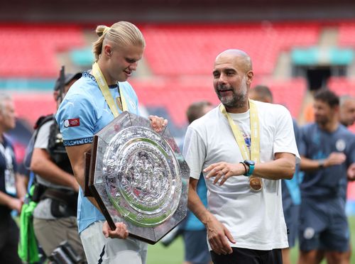 Manchester City boss Pep Gjuardiola (right)