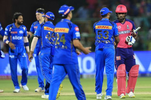 Rajasthan Royals captain Sanju Samson is exchanging gestures with Mumbai Indians players after their win in the Indian Premier League (IPL) 2024 cricket match between Rajasthan Royals and Mumbai Indians at Sawai Mansingh Stadium in Jaipur, Rajasthan, India, on April 22, 2024.