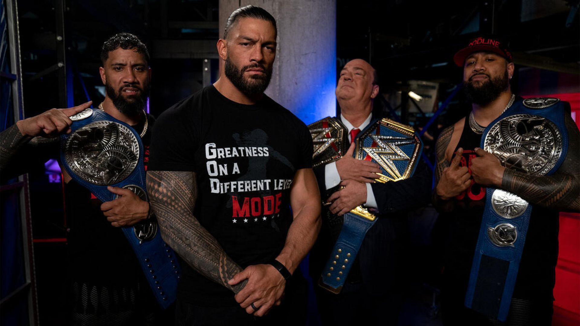 The Usos pose with Roman Reigns and Paul Heyman [Photo Credit: WWE.com]