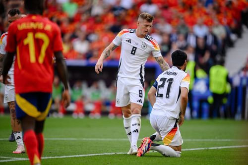 Toni Kroos (centre) and Ilkay Gundogan