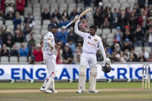 Kamindu Mendis raises his bat after his century. (Credits: Getty)