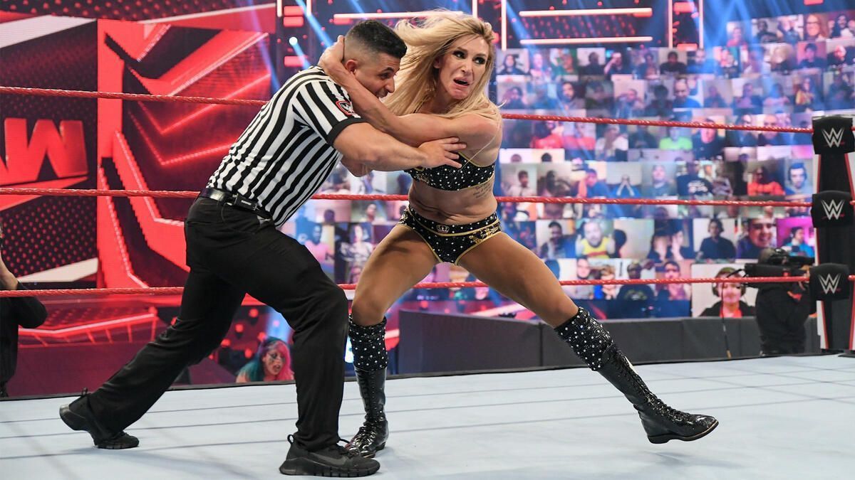 Charlotte Flair attacking a referee. [Image credits: WWE.com]