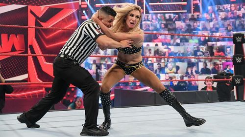 Charlotte Flair attacking a referee. [Image credits: WWE.com]