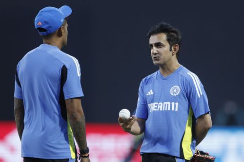 Gautam Gambhir, head coach of India, interacts with Suryakumar Yadav (C) of India before the start of game one of the T20 International series between Sri Lanka and India.