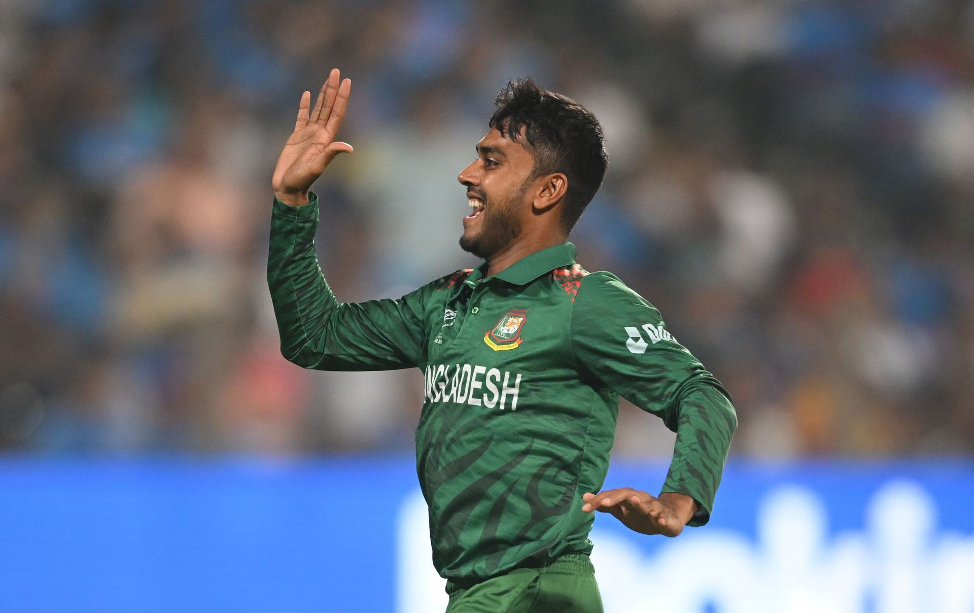 Mehidy Hasan of Bangladesh celebrates the wicket of Shubman Gill of India during the ICC Men's Cricket World Cup India 2023.