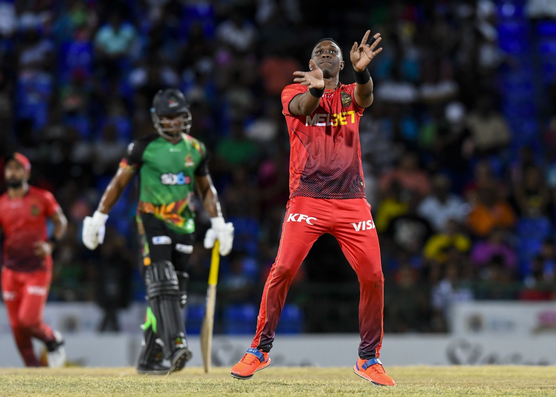 Dwayne Bravo celebrates a wicket in his trademark fashion. (Image Credits: Getty Images)