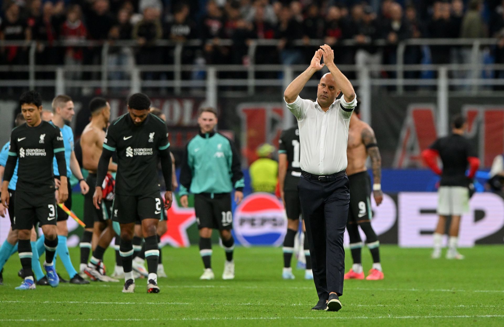 Reds manager Arne Slot applauds the away fans