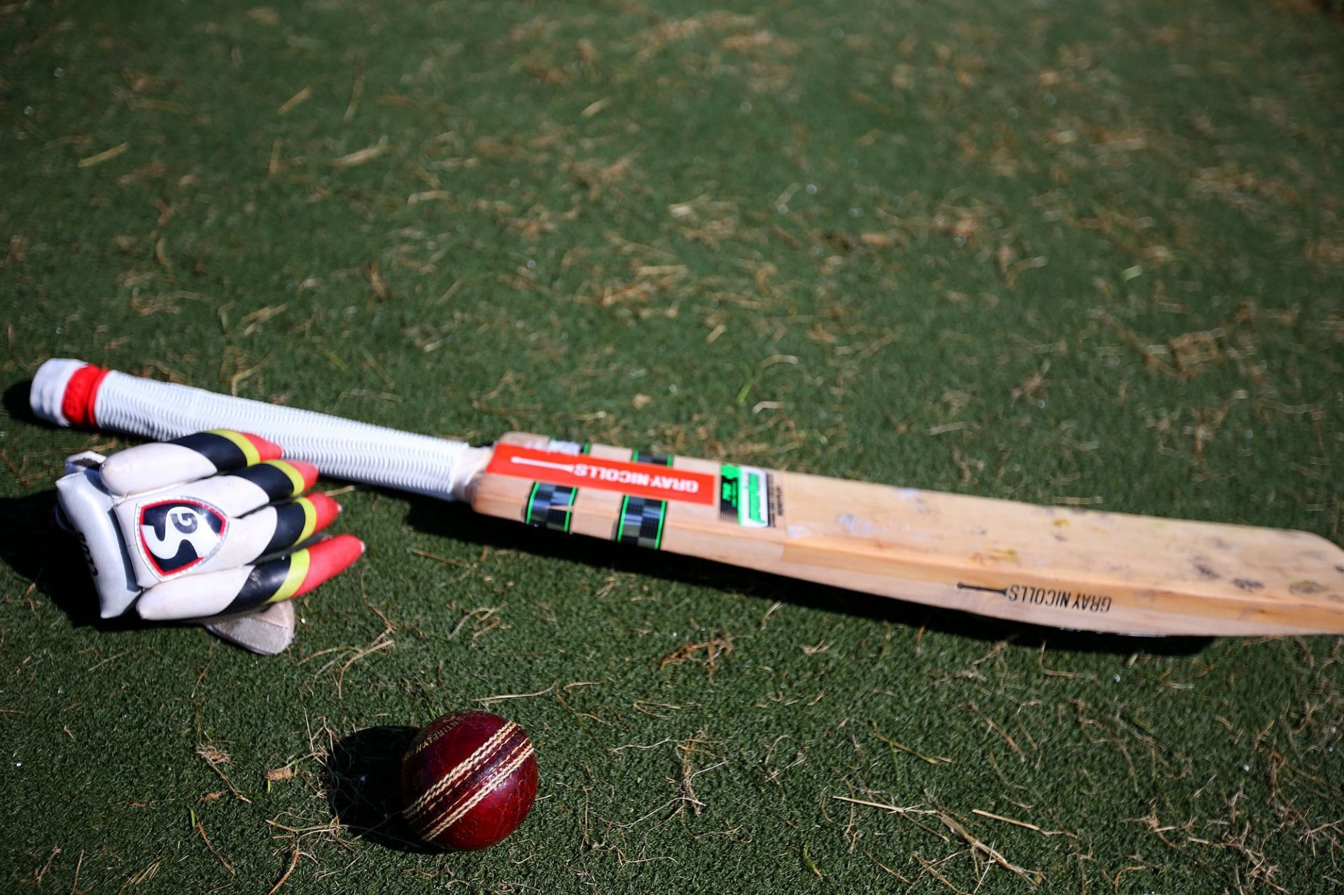 A cricket ball is photographed along with a batters glove, and bat, during a break in a game between the Mustangs and the Jaguars at Emarlad Glen Park on Sunday, April 3, 2016, in Dublin, Calif.  About 120 children are taking part in the San Ramon Cricket - Source: Getty