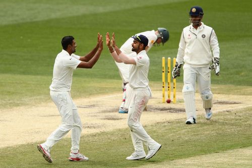 Ravichandran Ashwin (left) celebrating after picking up a wicket in the Boxing Day Test.