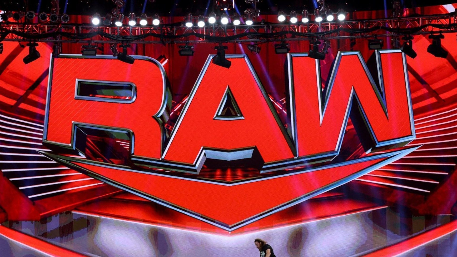 The official WWE RAW logo on display in the arena