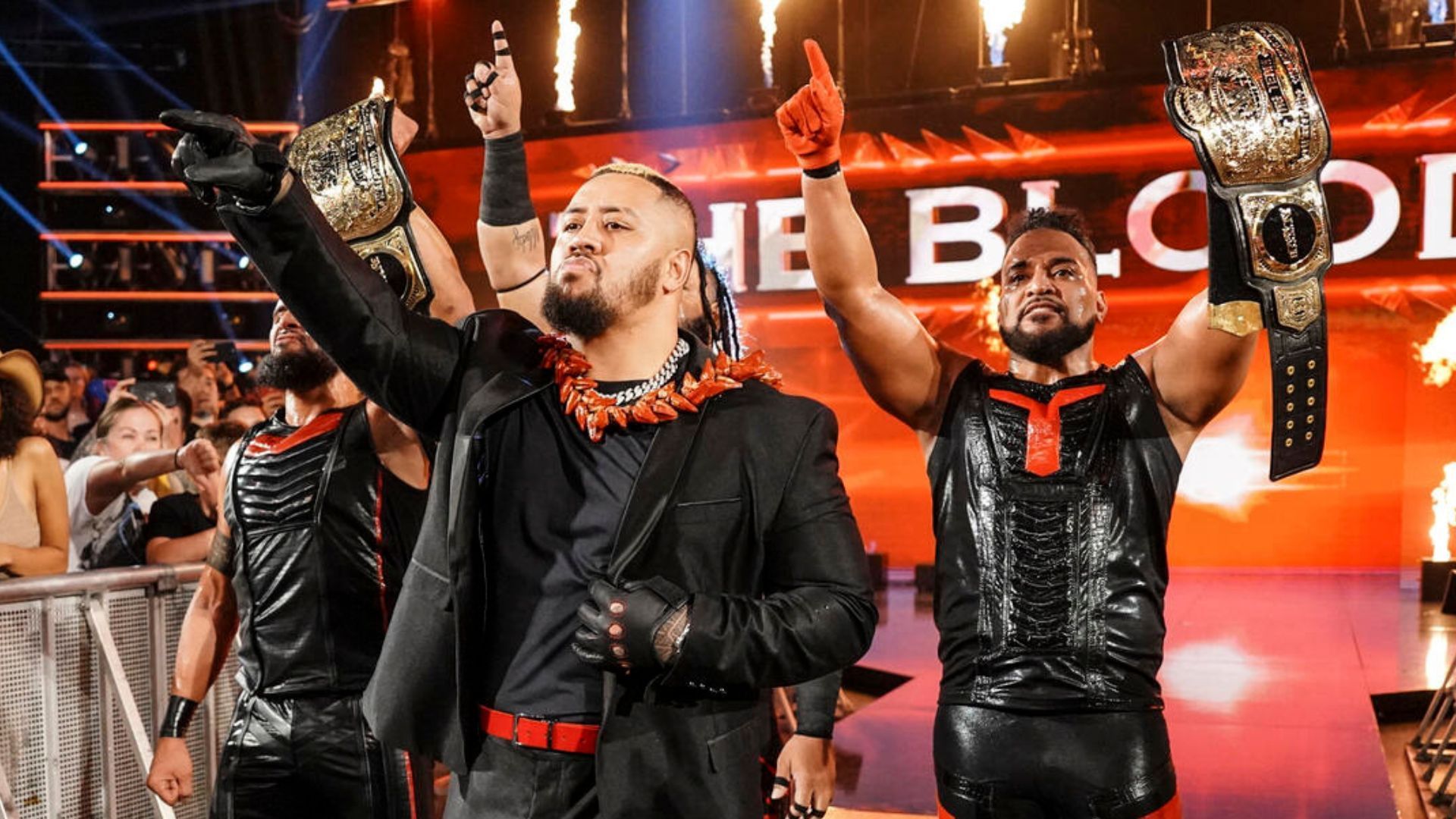 The Bloodline with the WWE Tag Team Championships! [Image credit: WWE.com]