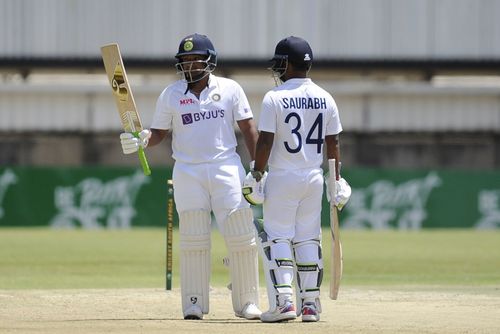 Sarfaraz Khan raises his bat. (Credits: BCCI Twitter)