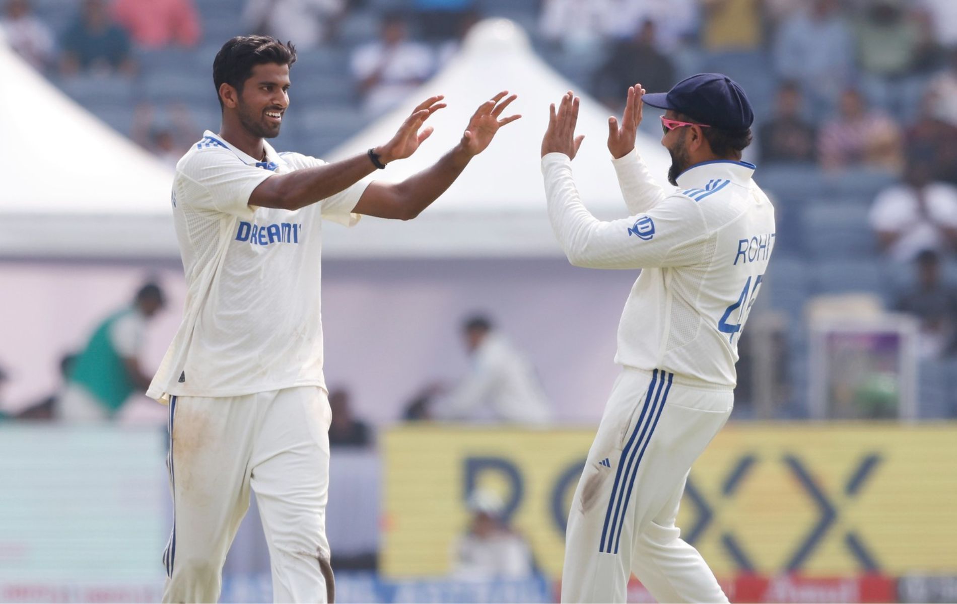 Washington Sundar celebrates a wicket with Rohit Sharma. (Pic: Instagram/@indiancricketteam)