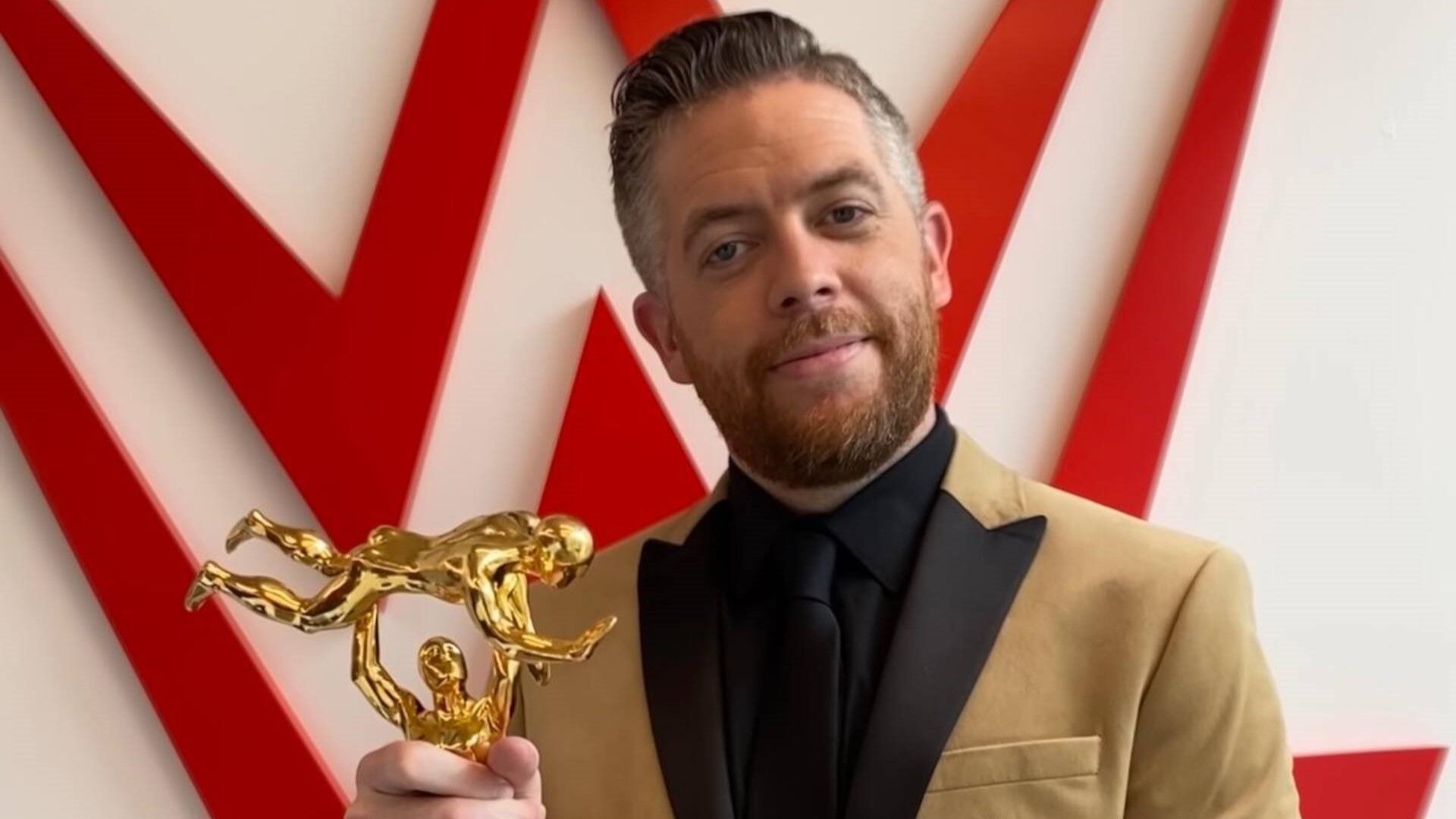 Matt Camp with a WWE Slammy Award