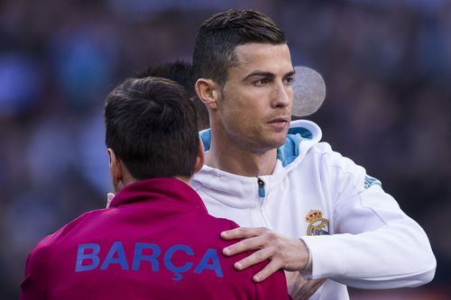 Cristiano Ronaldo (facing) and Lionel Messi