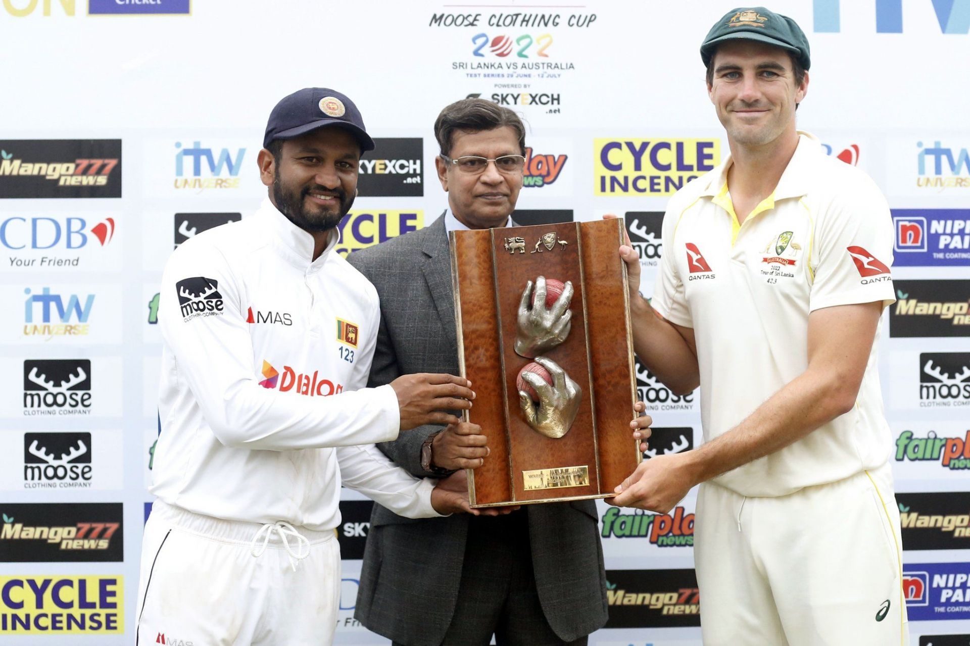 Pat Cummins and Dimuth Karunaratne with the Warne-Muralitharan Trophy. (Credits: SLC Twitter)