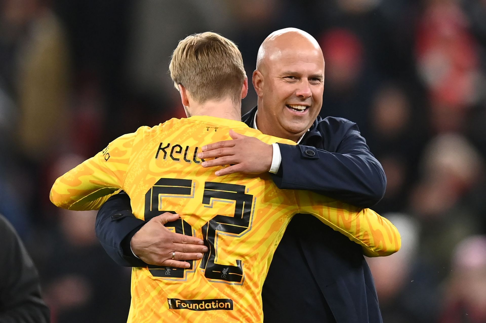 Caoimhin Kelleher celebrates with Arne Slot after Liverpool&#039;s win (Image - Getty)