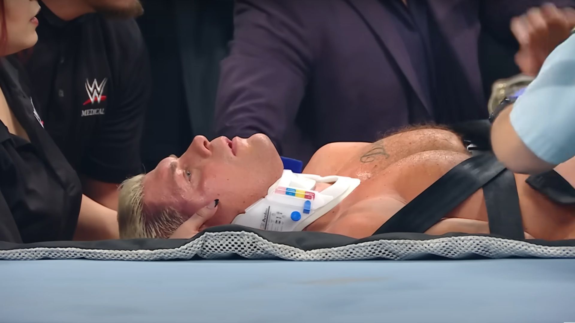 Cody Rhodes being put on a stretcher by the medical staff [Image Credits: WWE