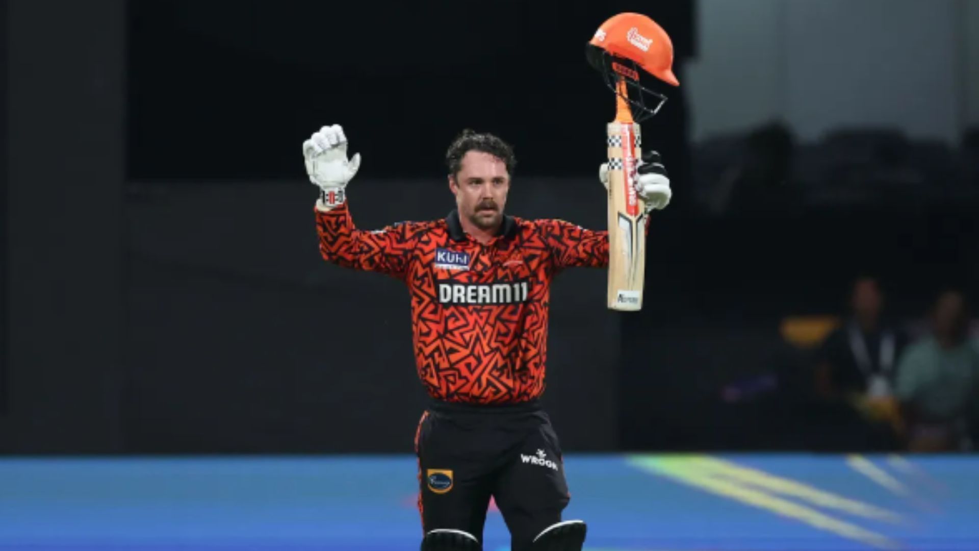 Travis Head raises his bat after scoring a century against RCB. (Source: IPL)