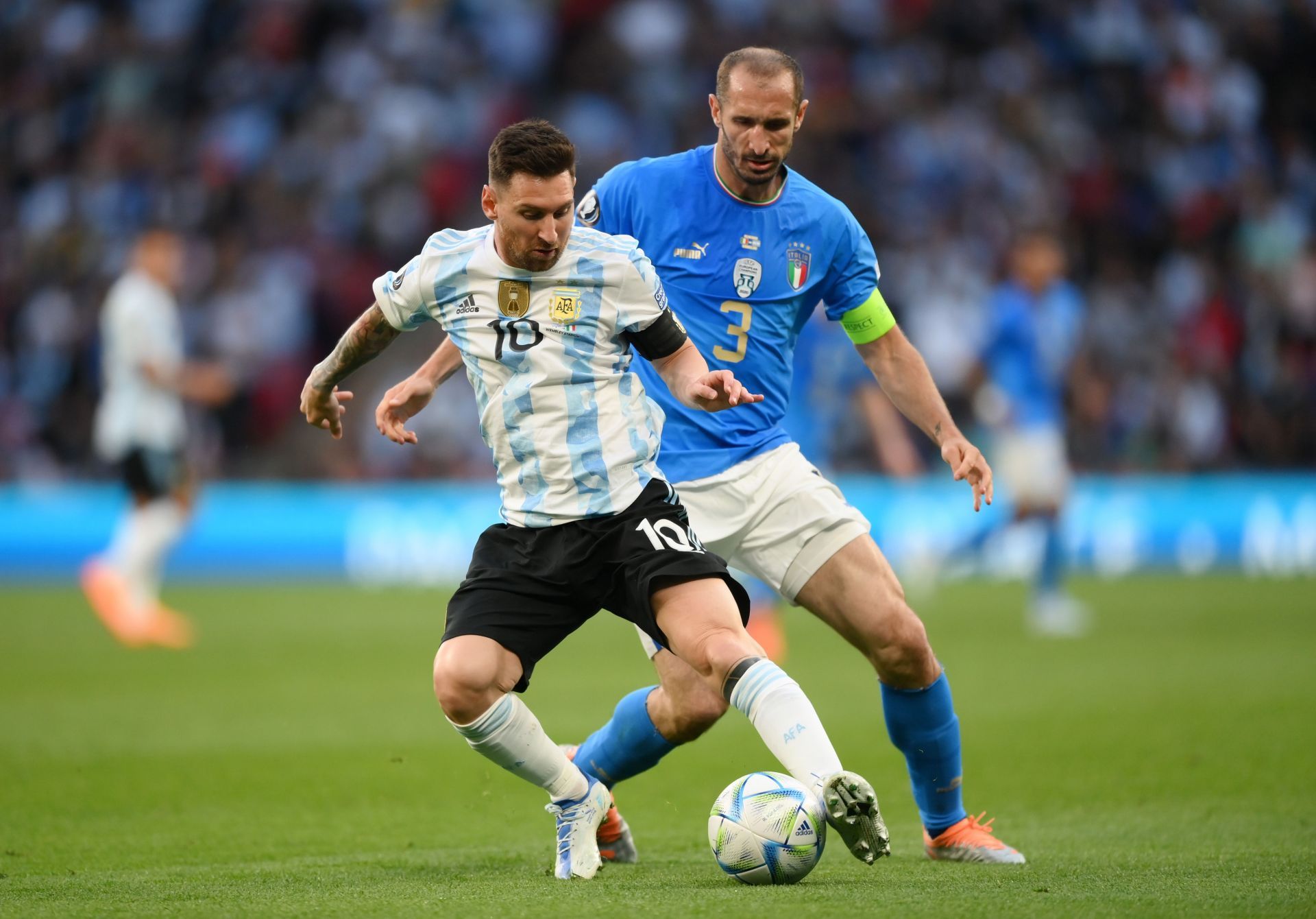 L to R: Messi and Chiellini - Source: Getty