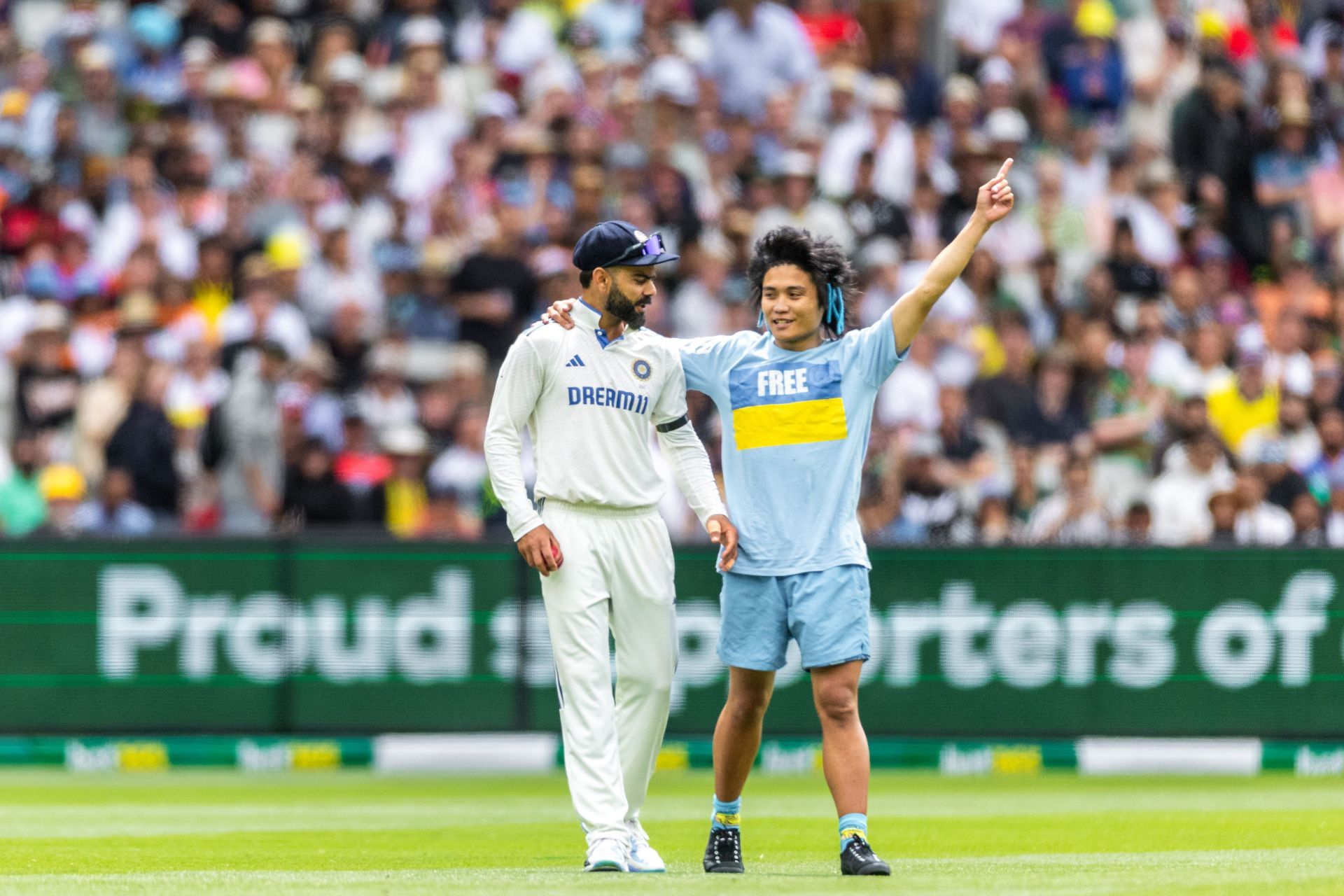 [In Pictures] Virat Kohli gives autographs to fans at the MCG during