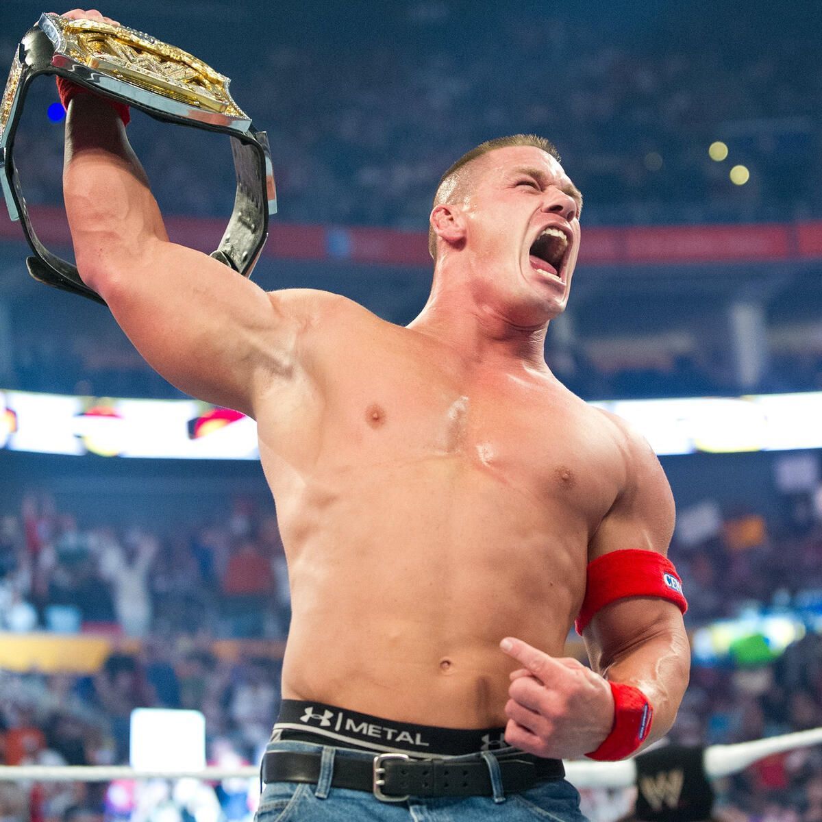 John Cena and the Spinner version of the WWE Championship. (Image credits: wwe.com)