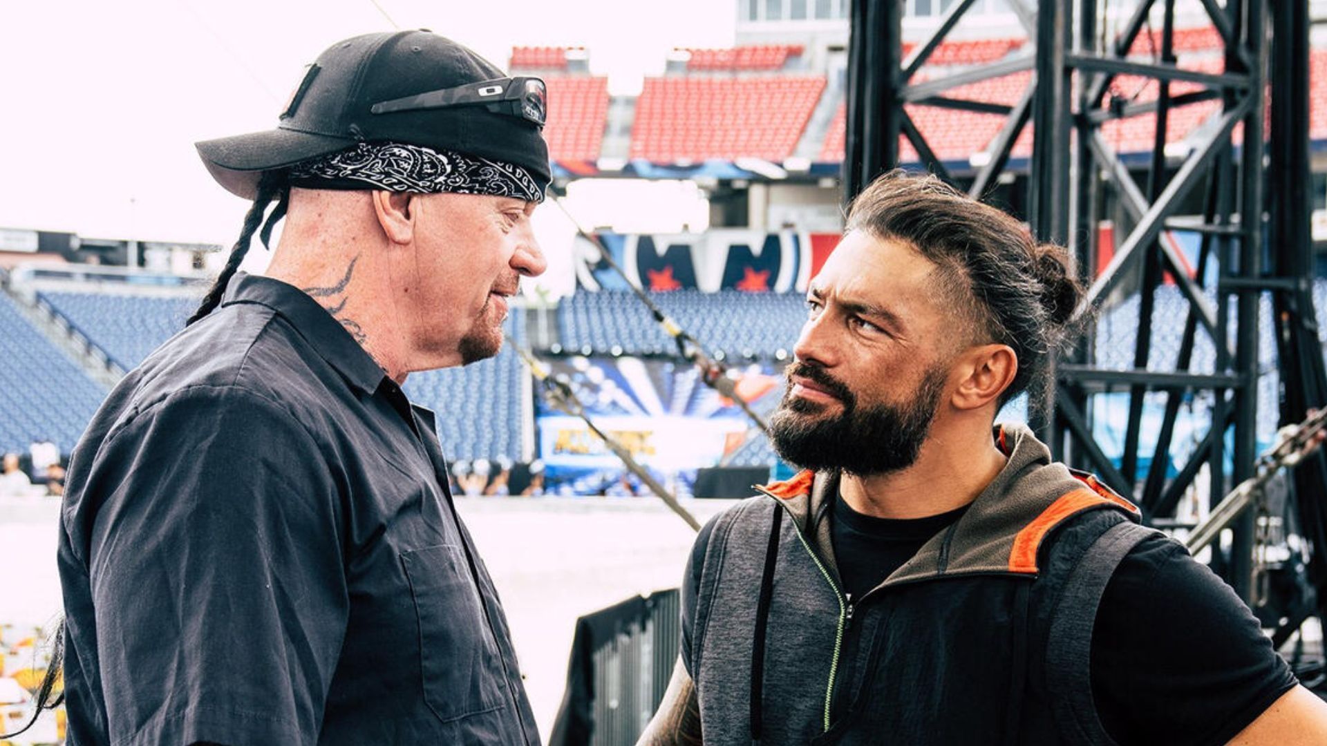 The Undertaker and Roman Reigns share a moment backstage at SummerSlam 2022 [Photo credit: Rich Wade, WWE.com]