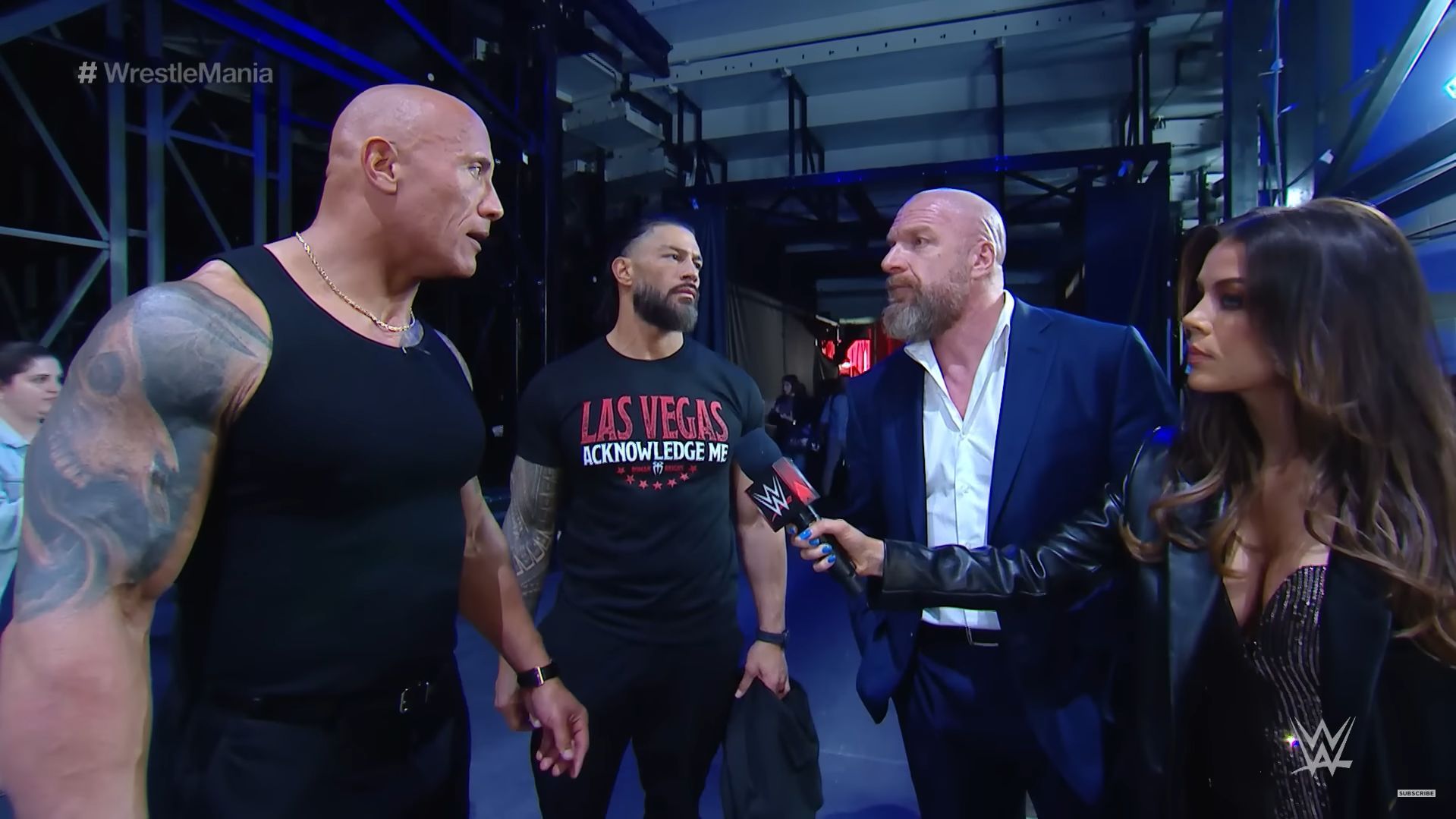 The Rock and Triple H arguing backstage (via WWE