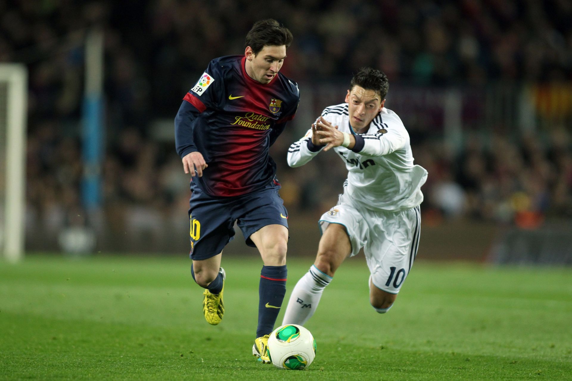 L to R: Messi and Ozil - Source: Getty