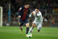 L to R: Messi and Ozil - Source: Getty