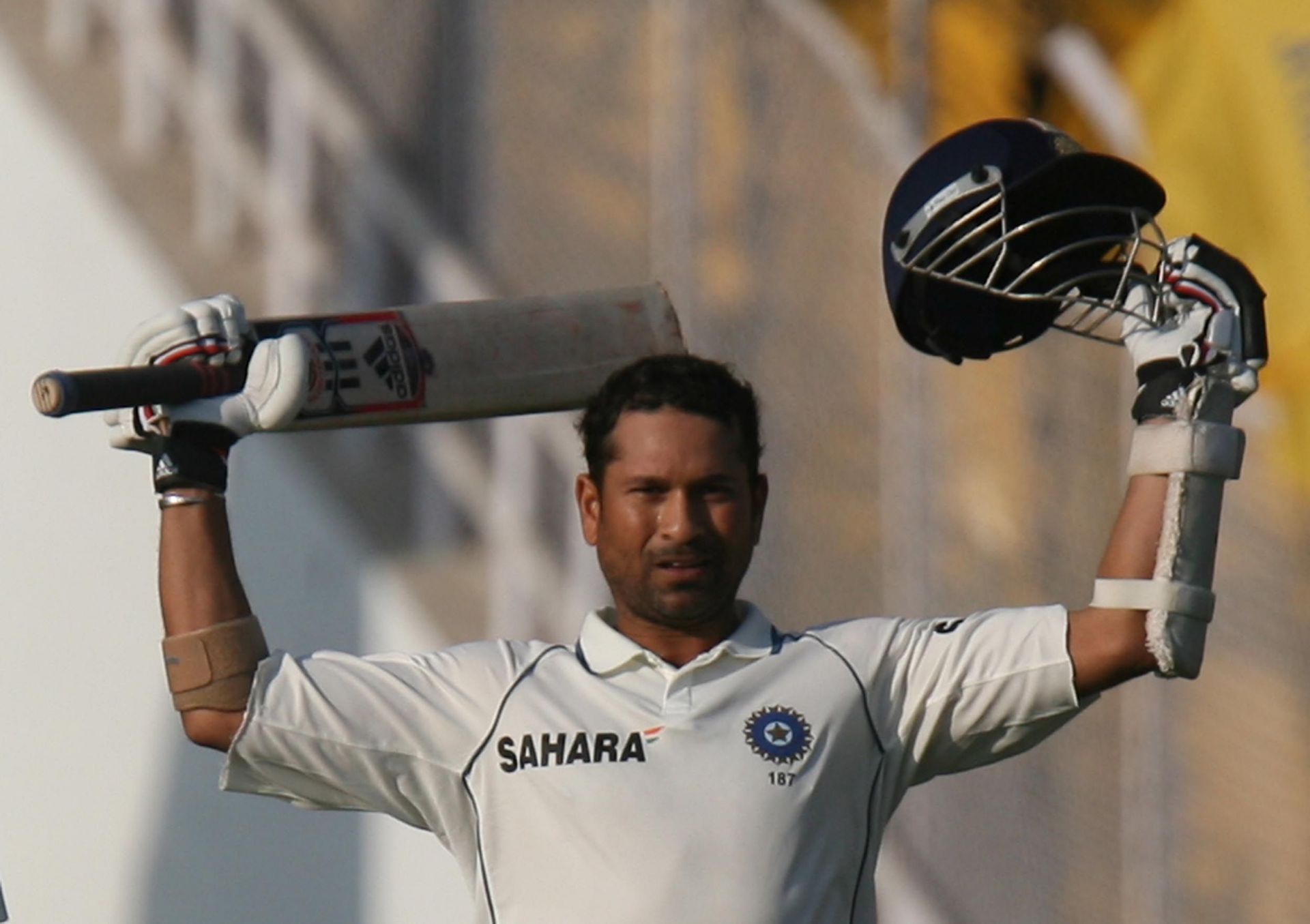 Sachin Tendulkar raises his bat after scoring a century against Sri Lanka. Source: Getty