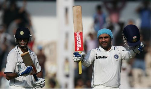 Sehwag celebrates scoring a Test century. Source: Getty