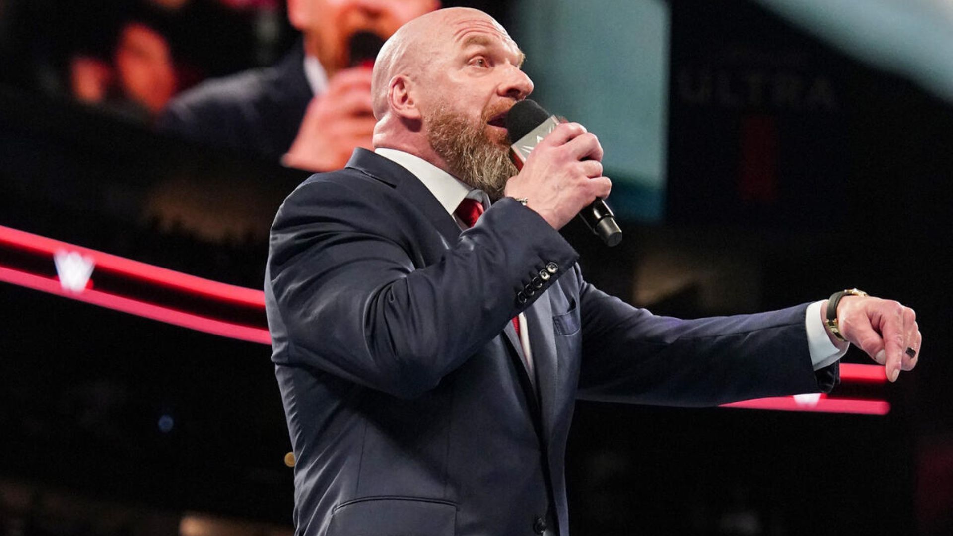 Triple H addressing the crowd during a show. [Image via WWE.com]