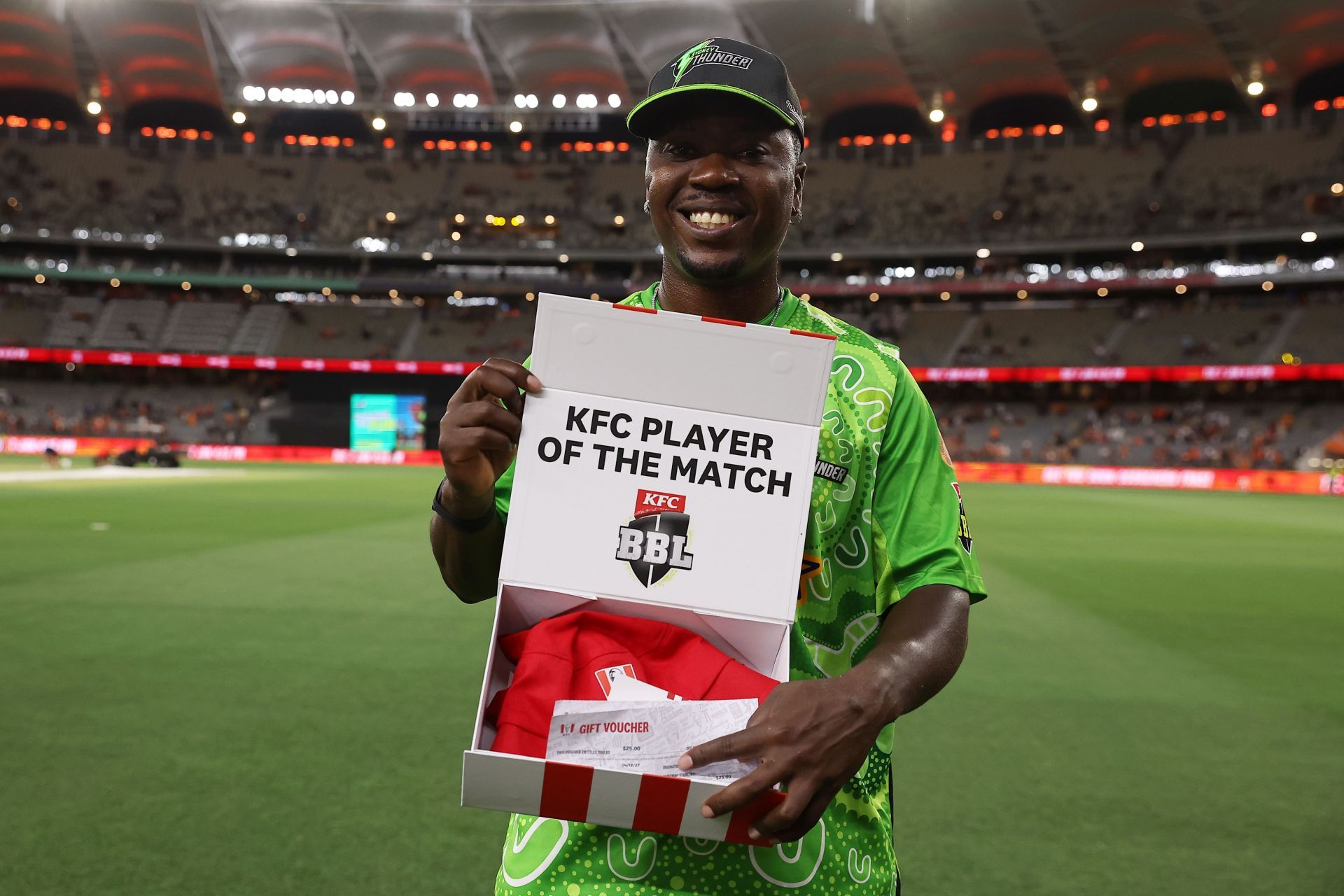 Sherfane Rutherford of the Thunder poses with the KFC player of the match award after the BBL match between Perth Scorchers and Sydney Thunder at Optus Stadium, on January 03, 2025, in Perth, Australia. (Photo by Will Russell - CA/Cricket Australia via Getty Images)