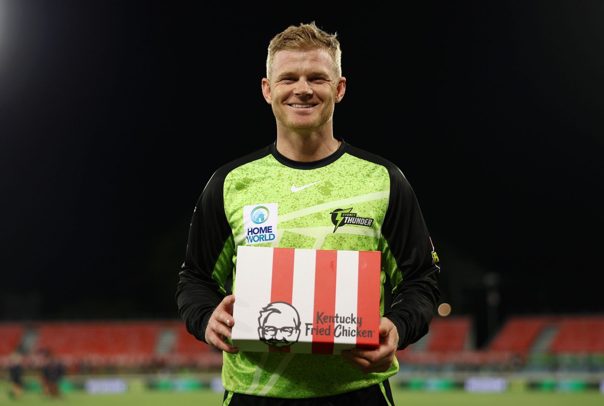 Sam Billings of the Thunder poses for a photo with the Player of the Match award following the BBL match between Melbourne Stars and Sydney Thunder at Manuka Oval, on December 28, 2024, in Canberra, Australia. (Photo by Mike Owen/Getty Images)