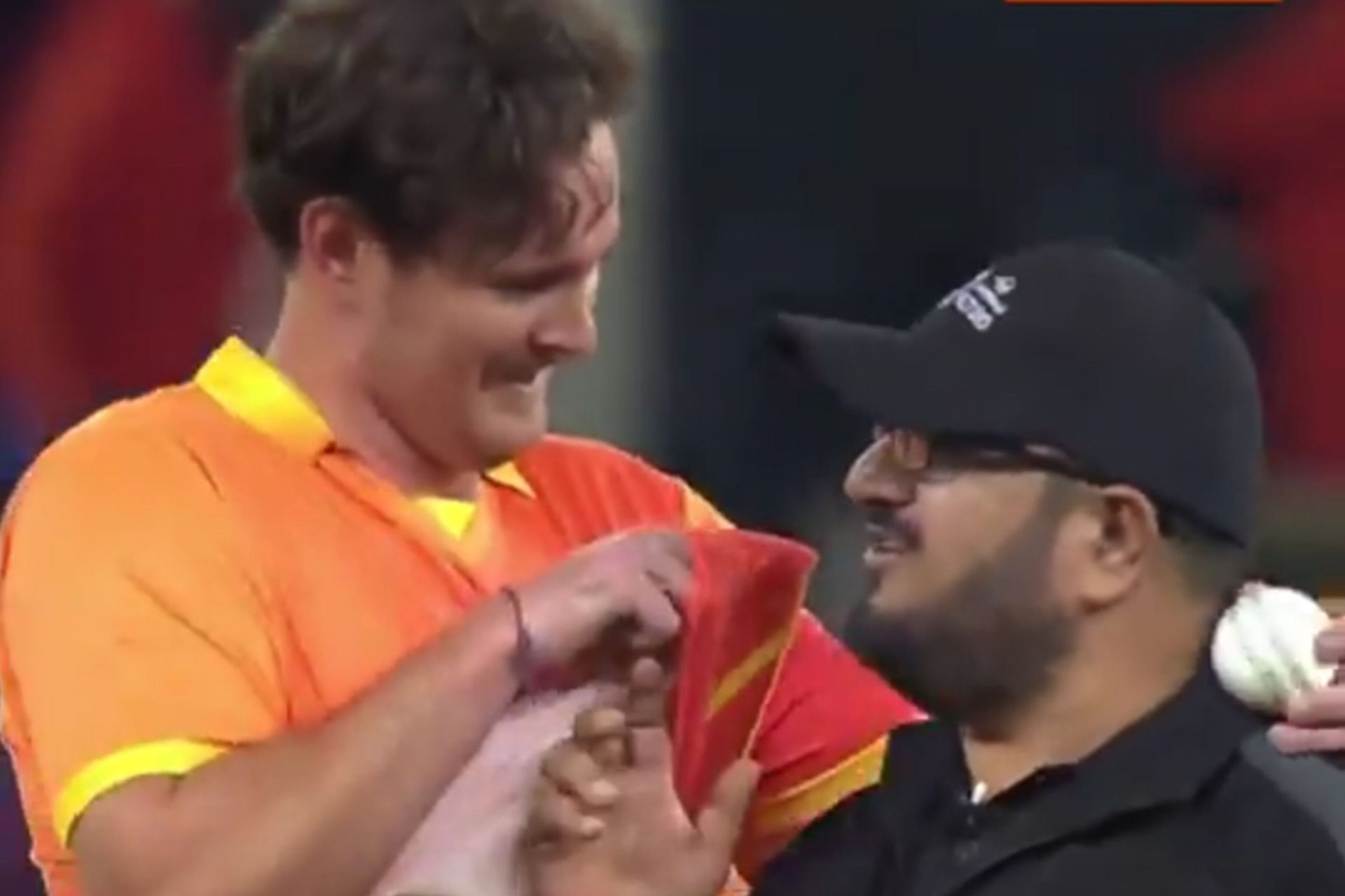 Mark Adair hilariously tries to clean umpire&rsquo;s glasses (Image via X-@FanCode)