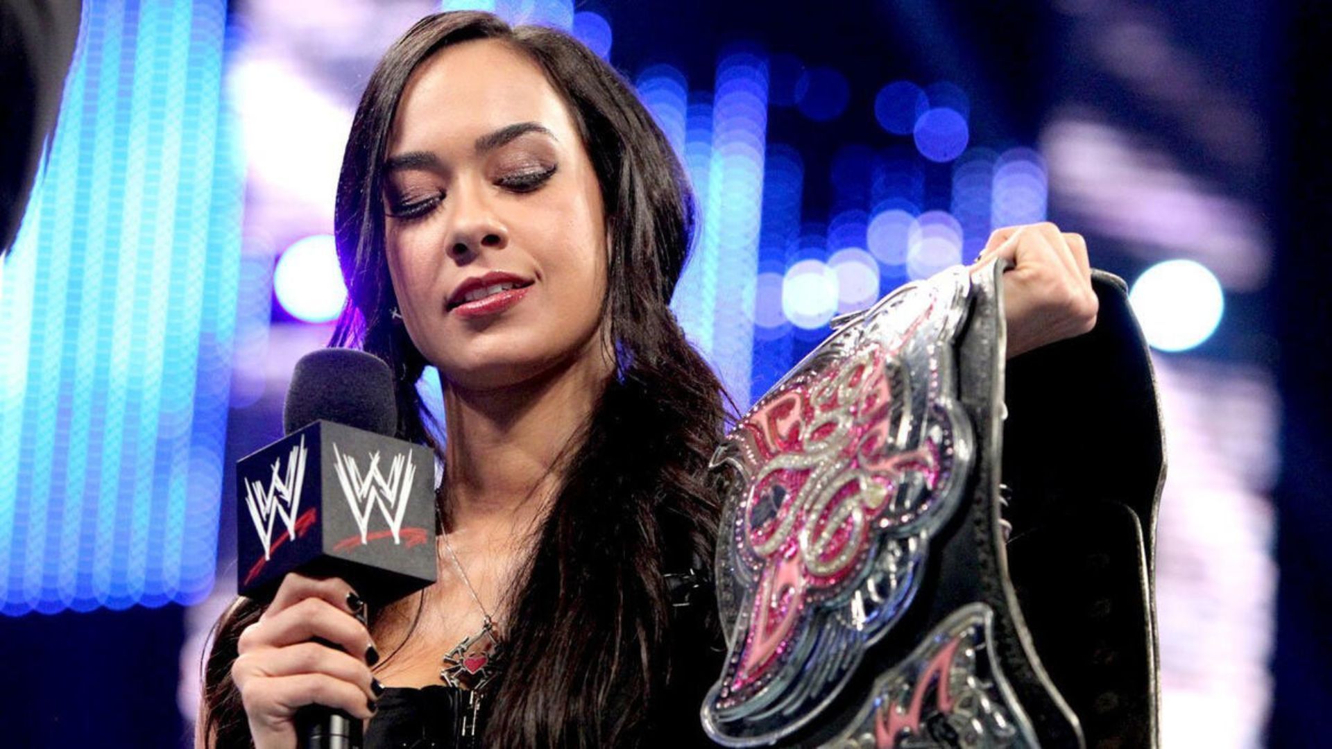 AJ Lee as WWE Divas Champion in 2013 [Photo credit: WWE.com]