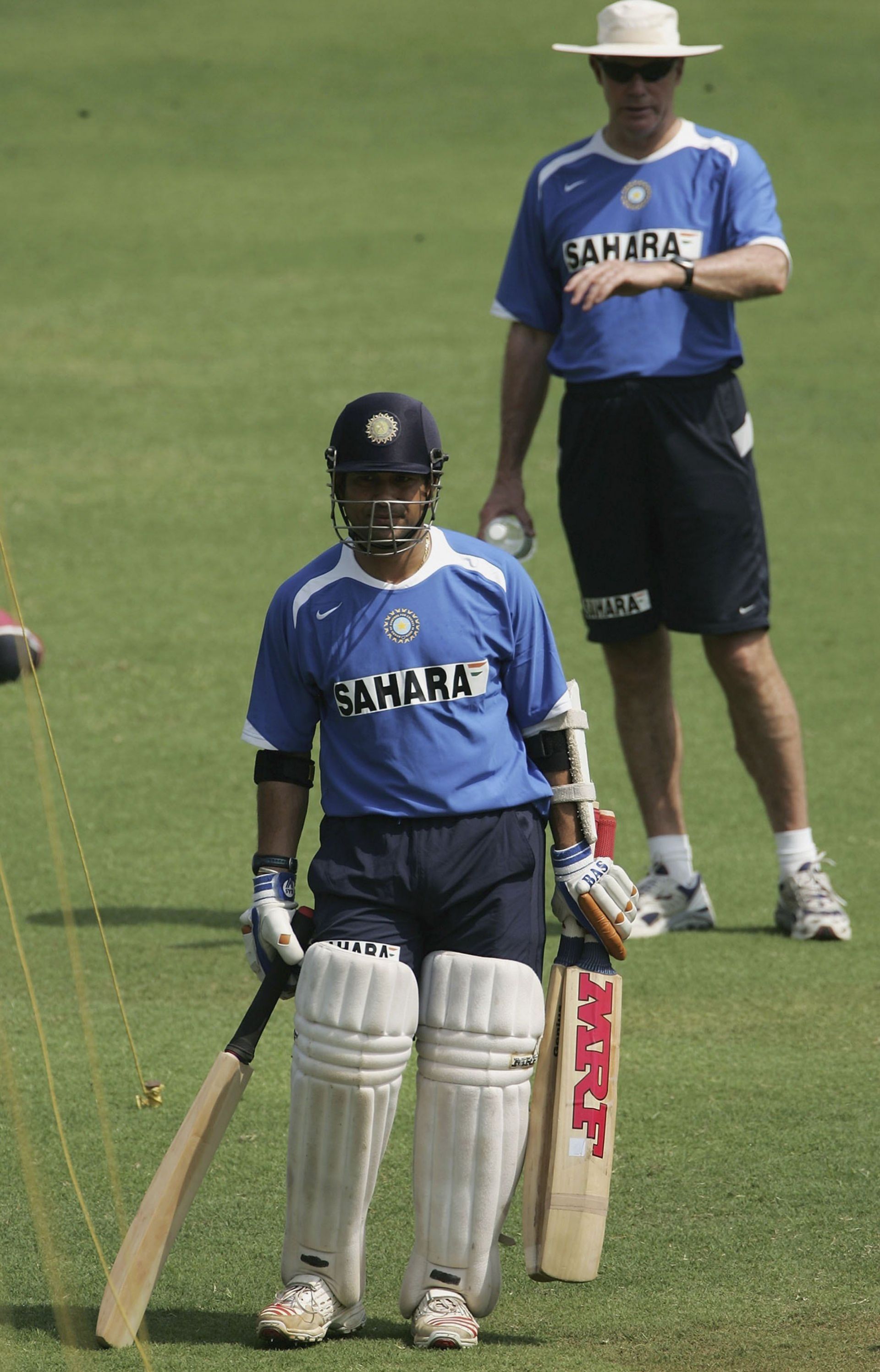 Sachin Tendulkar of India waits to bat as coach Greg Chappell looks on during the Indian nets session at the Wankhede Stadium on March 17, 2006 in Mumbai, India. (Photo by Tom Shaw/Getty Images)