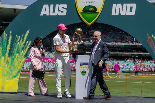 Pat Cummins takes the Border-Gavaskar Trophy. (Credits: Getty)