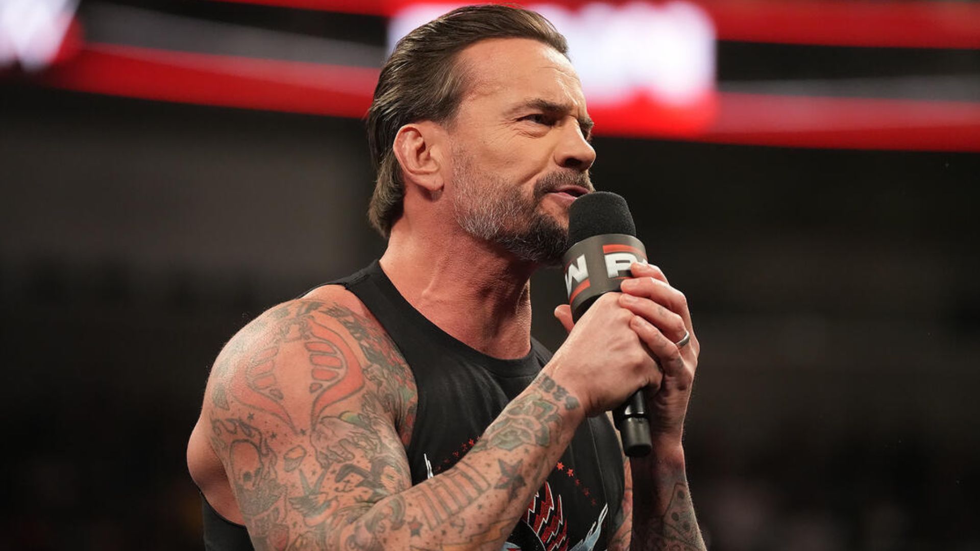 Punk was confronted by Seth Rollins and Drew McIntyre last night on RAW. [Image credit: WWE.com]