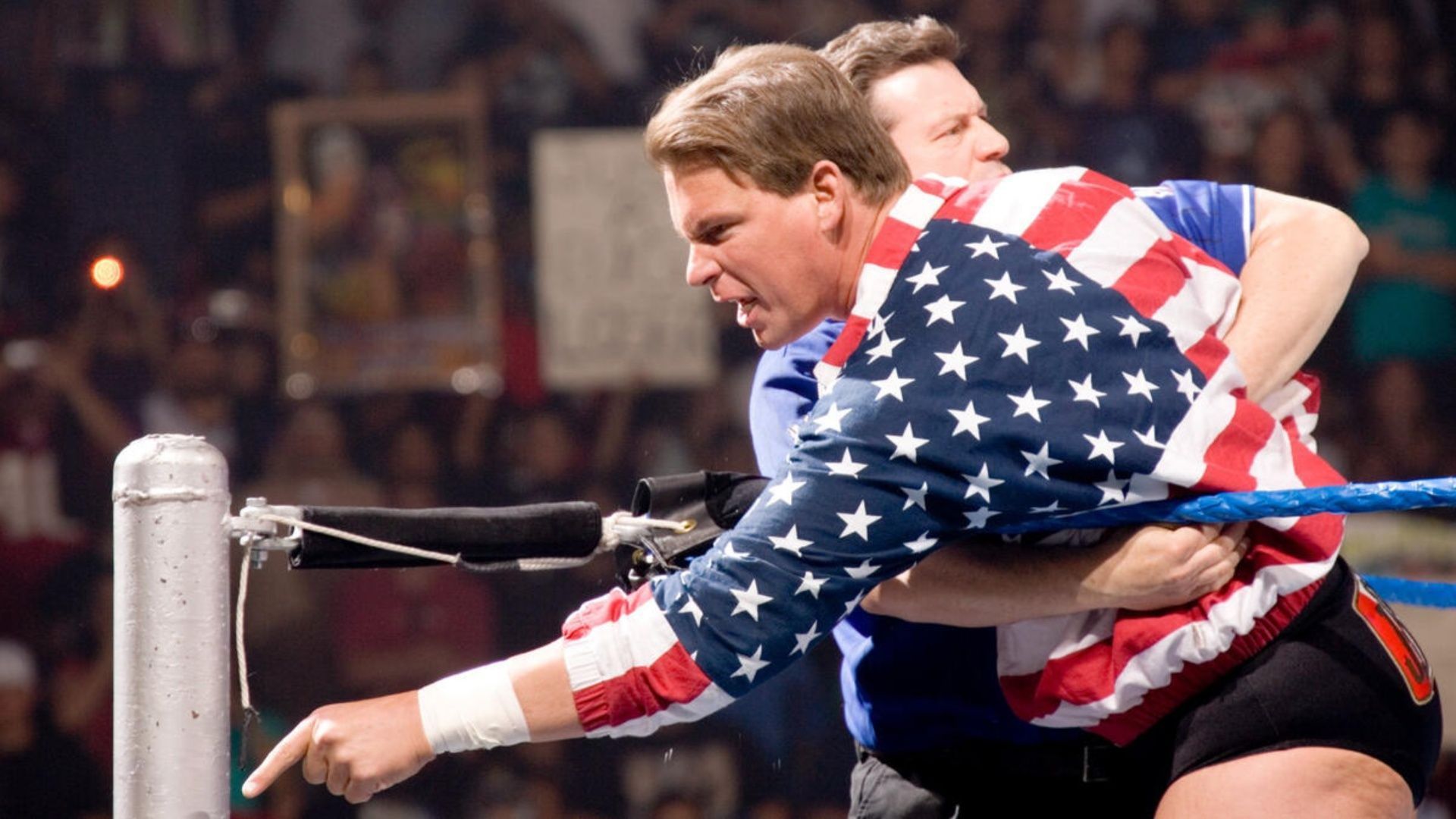 JBL being restrained by the referee during a WWE event (Image via WWE.com)