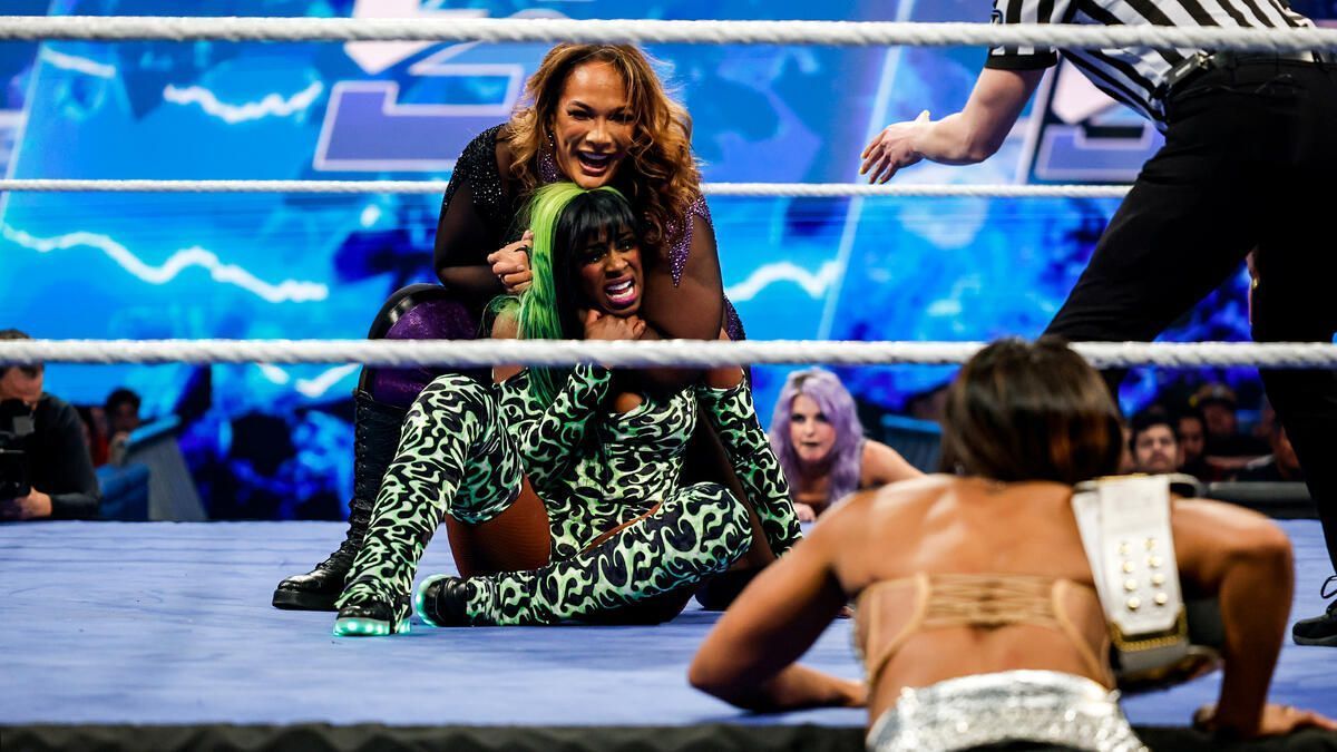 Bianca Belair watching on Nia Jax vs. Naomi (Image Credits: WWE.com)