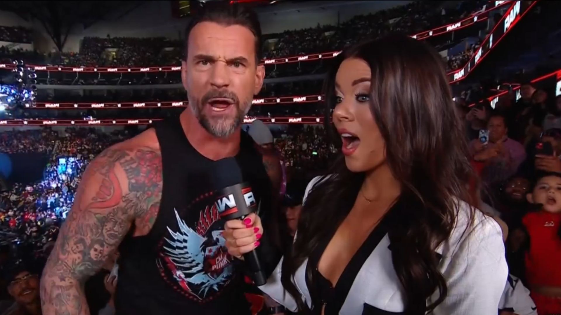 CM Punk and Jackie Redmond. [Image via WWE RAW